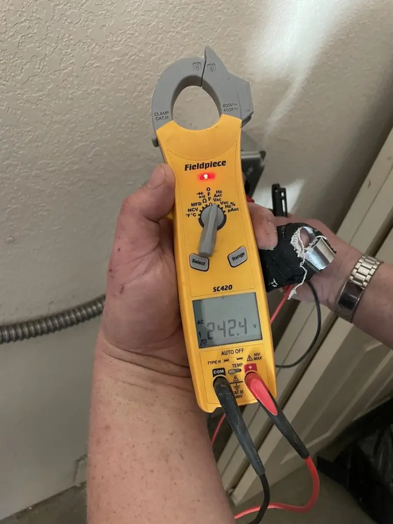 Voltage testing with clamp meter during Electrical Installation Services in Holtville
